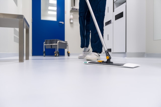 Professional cleaner mopping a spotless floor